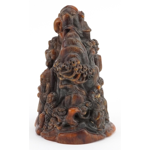 346 - A 20th century Chinese carved horn study of figures before mountains, 18cm high, 1243g.