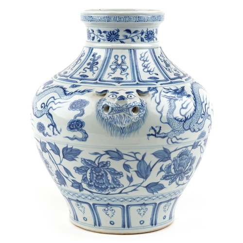 139 - A large Chinese porcelain blue and white vase with animal head handles and hand painted with dragons... 