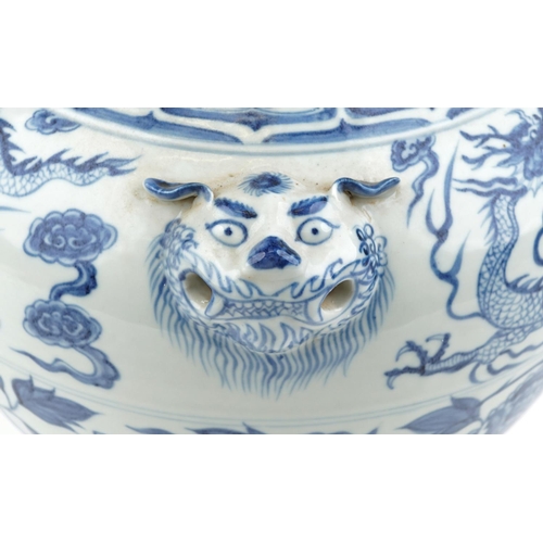 139 - A large Chinese porcelain blue and white vase with animal head handles and hand painted with dragons... 