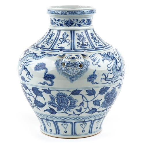 139 - A large Chinese porcelain blue and white vase with animal head handles and hand painted with dragons... 