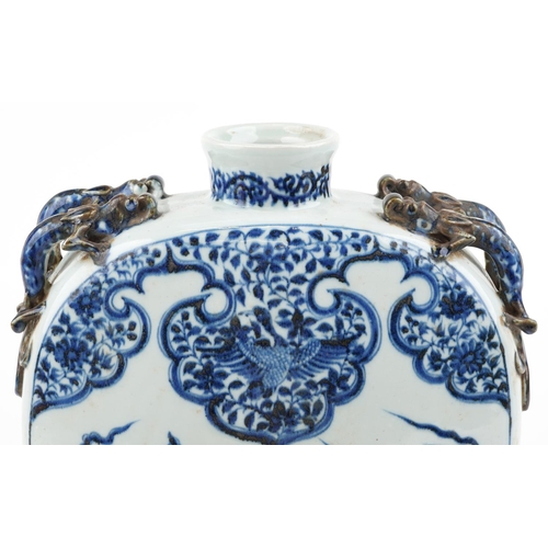 137 - A large Chinese stoneware blue and white vase having dragon handles, hand painted with a dragon and ... 