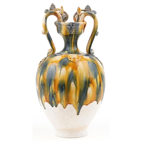 141 - A 20th century Chinese stoneware twin handled vase with blue and yellow drip glaze, 44cm high.