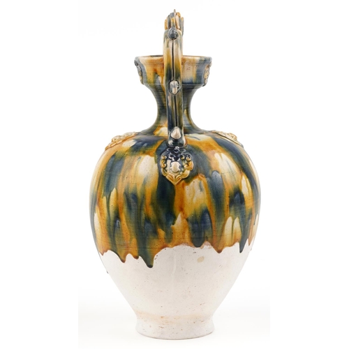 141 - A 20th century Chinese stoneware twin handled vase with blue and yellow drip glaze, 44cm high.