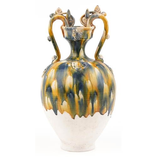 141 - A 20th century Chinese stoneware twin handled vase with blue and yellow drip glaze, 44cm high.