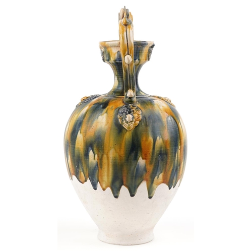 141 - A 20th century Chinese stoneware twin handled vase with blue and yellow drip glaze, 44cm high.