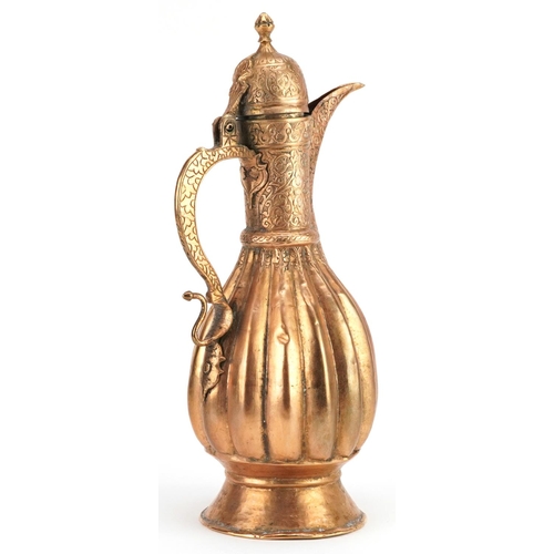 356 - A Turkish/Islamic gilded metal water flask, 31cm high.