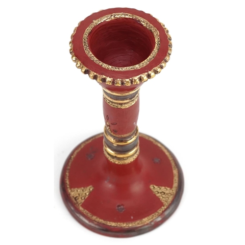 110 - A Turkish Tophane partially gilt pottery candlestick, 18cm high