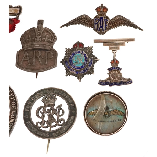  A collection of military interest silver badges and a Caledonian Society of London jewel, including ... 