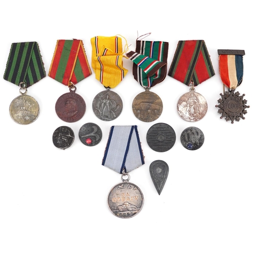 2413 - A collection of military interest medals and badges including European African Middle Eastern Campai... 