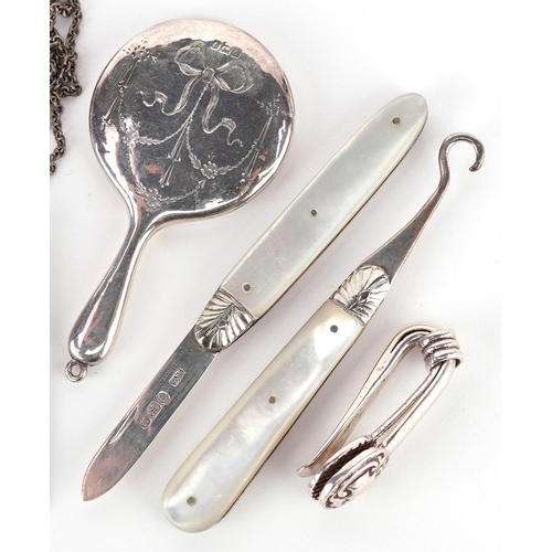 547 - Edwardian and later silver objects including mother of pearl handled folding fruit knife and buttonh... 