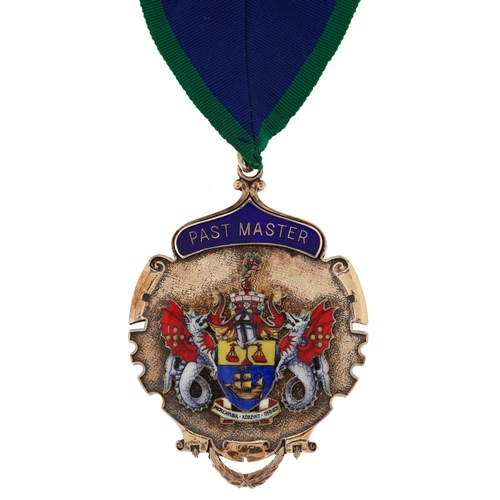  A large silver gilt and enamel masonic Past Master jewel with sash housed in a Toye, Kenning & Spenc... 