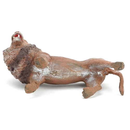 1242 - After Franz Xaver Bergmann, a cold painted bronze study of a lion, 9.5cm in length.