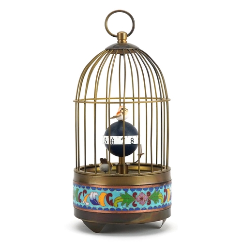 1186 - A brass and cloisonné clockwork automaton bird cage with alarm clock, 20cm high.