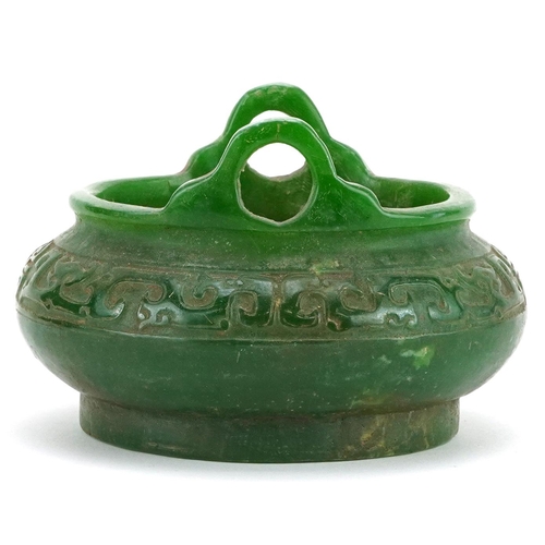 100 - A Chinese jade style censer with twin handles, 14cm in diameter.