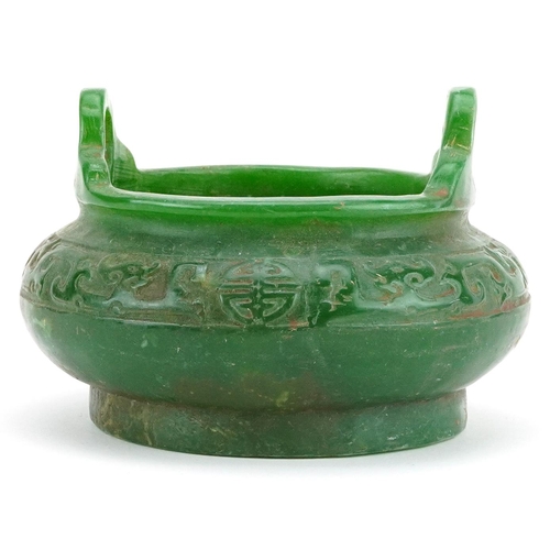 100 - A Chinese jade style censer with twin handles, 14cm in diameter.