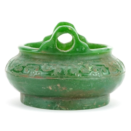 100 - A Chinese jade style censer with twin handles, 14cm in diameter.