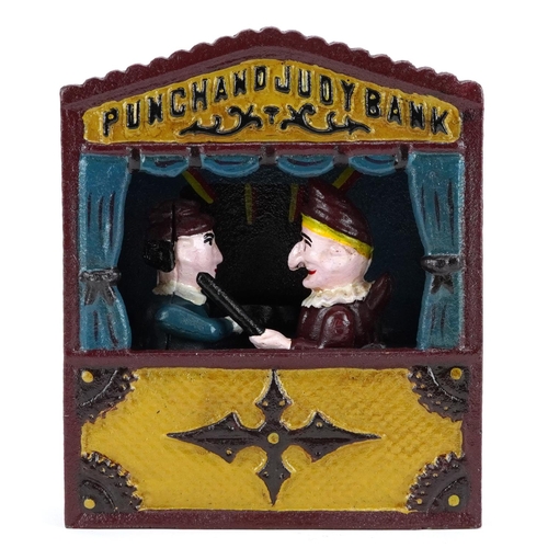 1196 - A novelty cast iron Punch & Judy money bank, 18cm high.