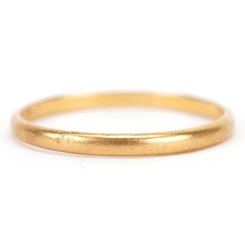 3065 - A 22ct gold wedding band, size Q, 1.5g.