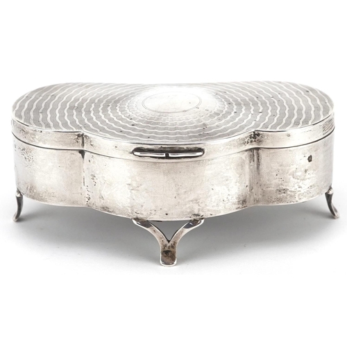 502 - D Bros., an Edwardian shaped silver jewel box raised on three feet having hinged lid and fitted inte... 