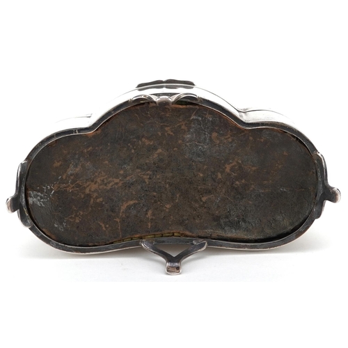 502 - D Bros., an Edwardian shaped silver jewel box raised on three feet having hinged lid and fitted inte... 