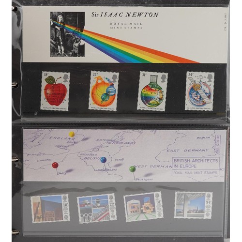 2232 - Presentation packs of stamps housed in four red ring binders numbered 1-4