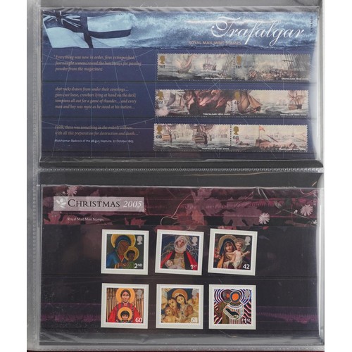 2233 - British Presentation packs of stamps housed in four red albums numbered 5-8