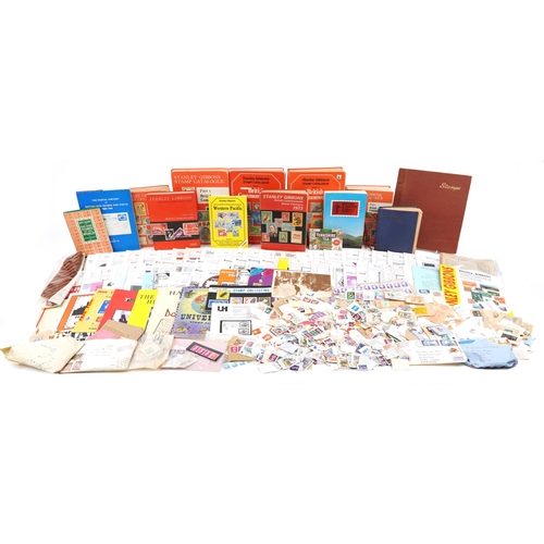 2238 - Two boxes of stamp ephemera to include loose stamps, catalogues, The Postal History of British New G... 