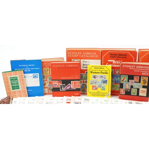 2238 - Two boxes of stamp ephemera to include loose stamps, catalogues, The Postal History of British New G... 