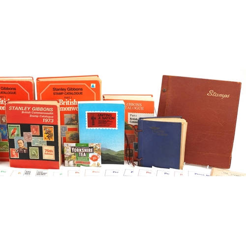 2238 - Two boxes of stamp ephemera to include loose stamps, catalogues, The Postal History of British New G... 