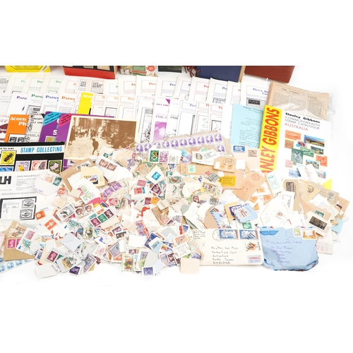 2238 - Two boxes of stamp ephemera to include loose stamps, catalogues, The Postal History of British New G... 