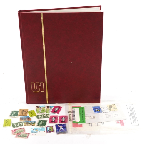 2218 - Red stamp album containing 19th century and later commonwealth stamps, mainly Papua, many cricket re... 