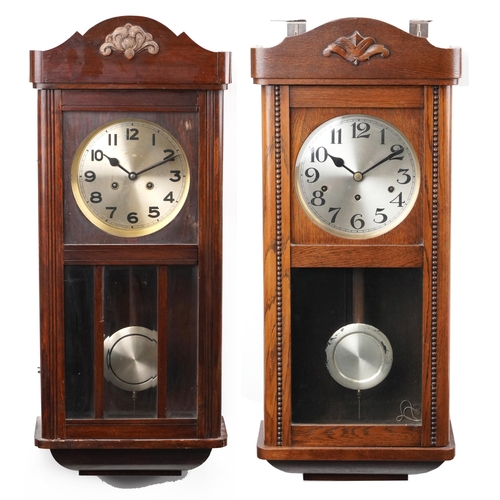 1311 - Two Vienna style wall hanging clocks, one with Westminster chime, each 68cm in length.