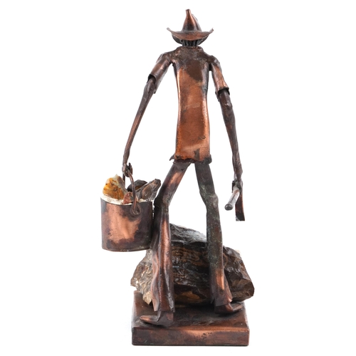 403 - A copper and opal sculpture of an Australian opal miner, indistinctly signed, 21cm high.