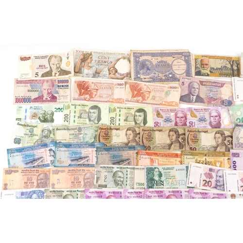 2216 - A quantity of vintage banknotes to include France, Mexico, Portugal, India and Sri Lanka.