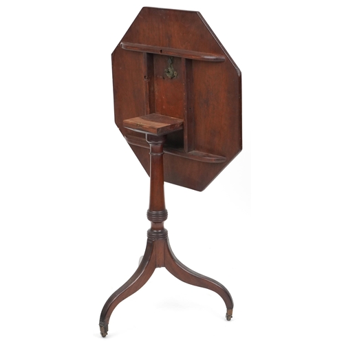 2047 - An early 19th century mahogany octagonal tip top wine table with crossbanded decoration raised on tr... 