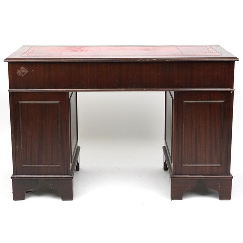 2027 - A late 20th century mahogany twin pedestal desk, 80cm H x 122cm W x 60cm D.