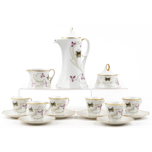 1231 - A Czechoslovakian Pirkenhammer six place tea set with gilded edges, the teapot 24cm high.