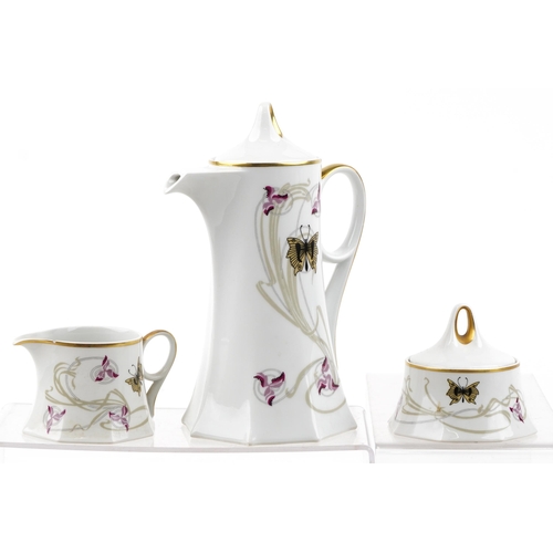 1231 - A Czechoslovakian Pirkenhammer six place tea set with gilded edges, the teapot 24cm high.