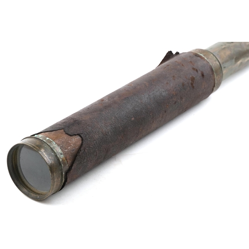 2471 - An early 20th century brass and leather bound four draw telescope by W & S. Jones, London, 150cm ext... 