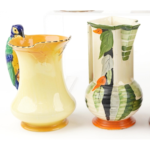 191A - A group of nine early 20th century pottery jugs and vases to include Beswick ware, Crown Ducal ware,... 