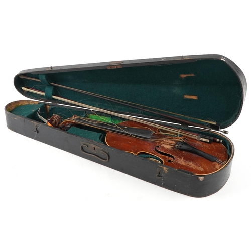 1041 - A 20th century violin, the length of back excluding button 36cm, together with two bows and a hard c... 