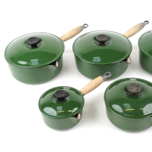 1148 - A vintage set of seven cast iron Le Creuset saucepans and covers.