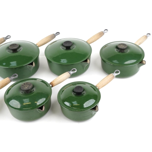 1148 - A vintage set of seven cast iron Le Creuset saucepans and covers.