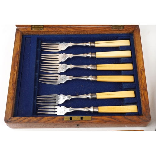 594 - An early 20th century Mappin & Webb plated set of fish knives and forks with bone handles within a c... 