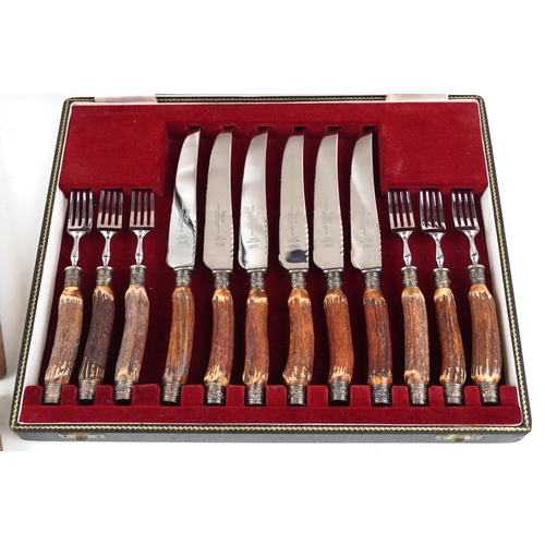 594 - An early 20th century Mappin & Webb plated set of fish knives and forks with bone handles within a c... 