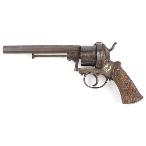 2550 - A 19th century silver inlaid pinfire officer's revolver with octagonal barrel, 27cm in length.