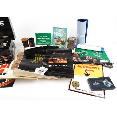 2329 - Vintage and later Guinness memorabilia including 1997 calendar, bar mats, The Guinness Book of Recor... 