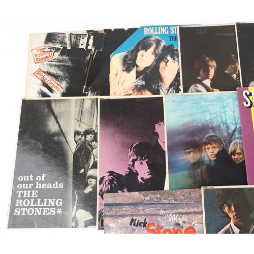 1052 - A group of The Rolling stones vinyl LP records including Sticky Fingers with zip sleeve, Through the... 