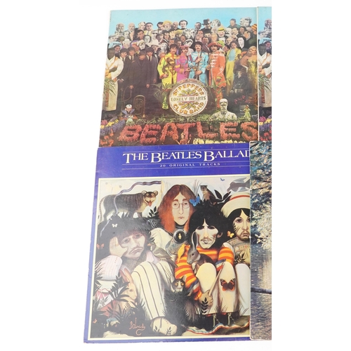 1051 - A group of The Beatles vinyl LP records including Sgt. Pepper's Lonely Hearts Club Band and Rubber S... 