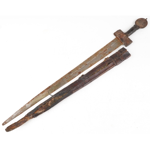 2533 - An antique Middle Eastern short sword with leather sheath, 82cm in length.